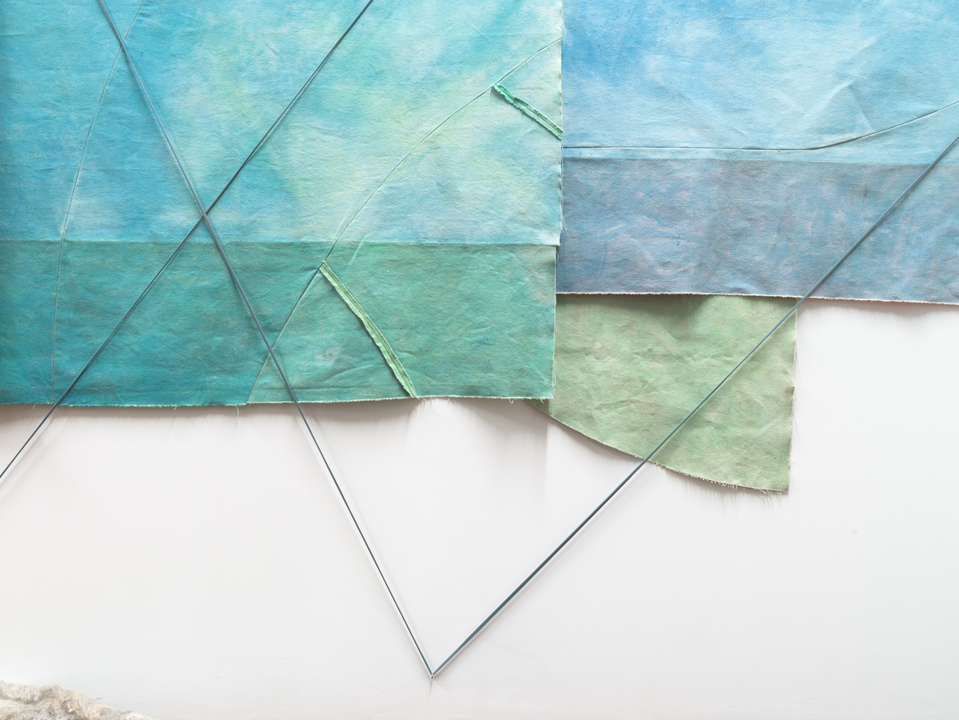 Image: Emma Fitts, From heat to translucence / your mineral touch (detail), 2023. Weathered canvas, felted wool, aluminium and wooden rods, fabric ties. Photo by John Collie.