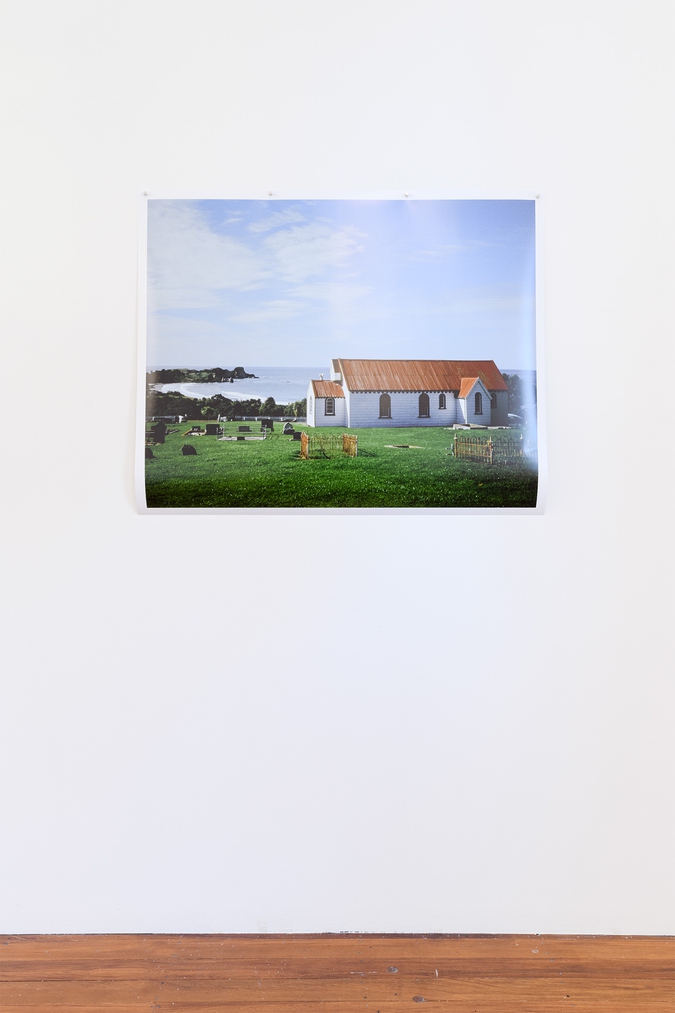 artwork, photograph titled anamata, large format photograph featuring a old white wooden church, urupa and the ocean on the horizon
