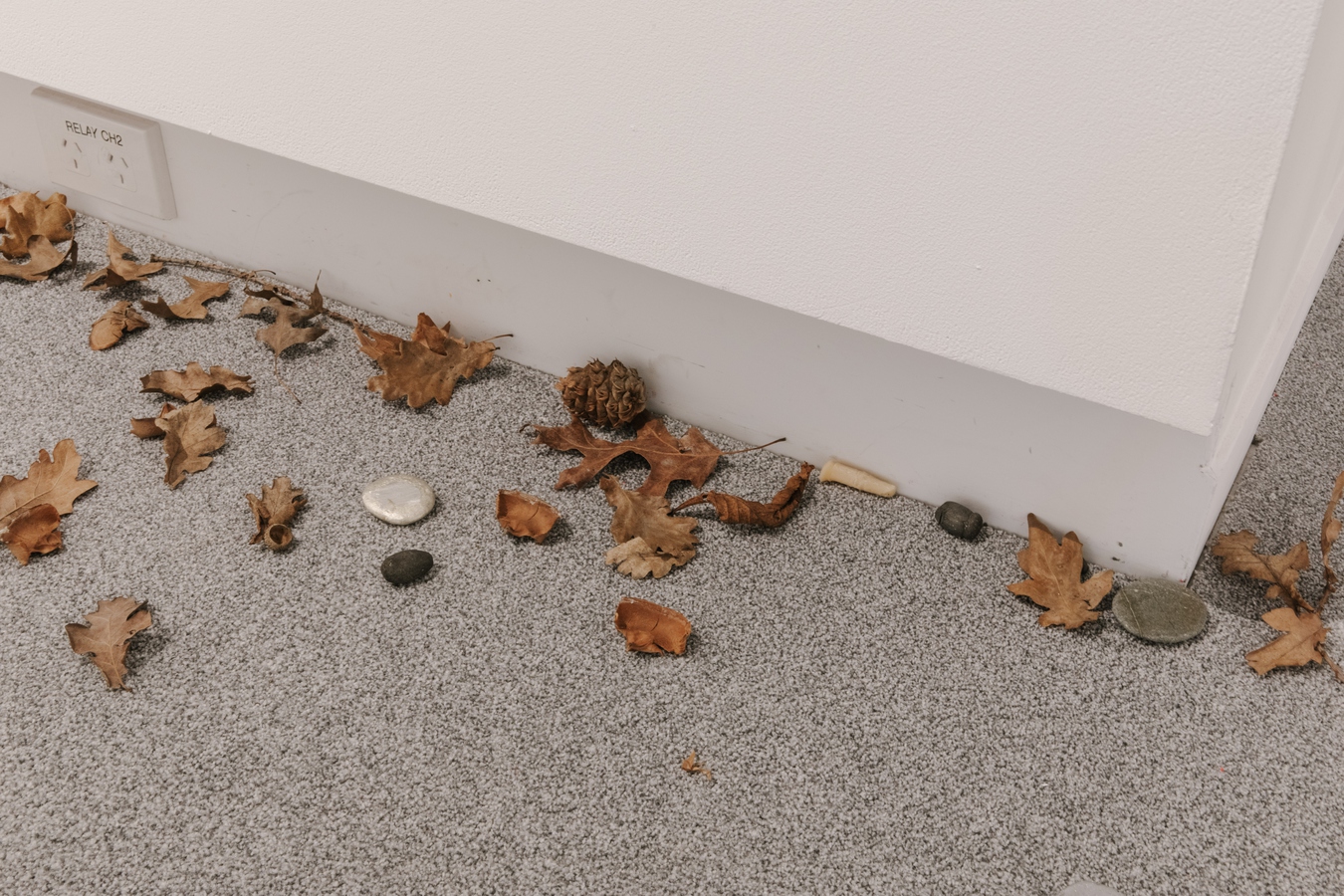 Image: Yukari Kaihori, The Stepping Stones (detail), 2022. Fired recycled glass tiles, recycled clay tiles with wood-ash glaze, wax, pewter, clay, aluminium, agate, found objects, ash painting. Photo by Nancy Zhou.