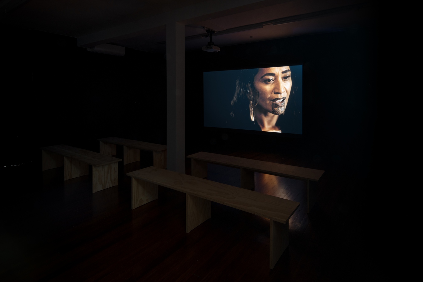 Installation view of Luke Willis Thompson, Whakamoemoeā, 2024. 4K digital video, colour, 5.1 surround sound, 21 mins. Commissioned by Sharjah Art Foundation and produced by Ordinary Films and Kura Productions.