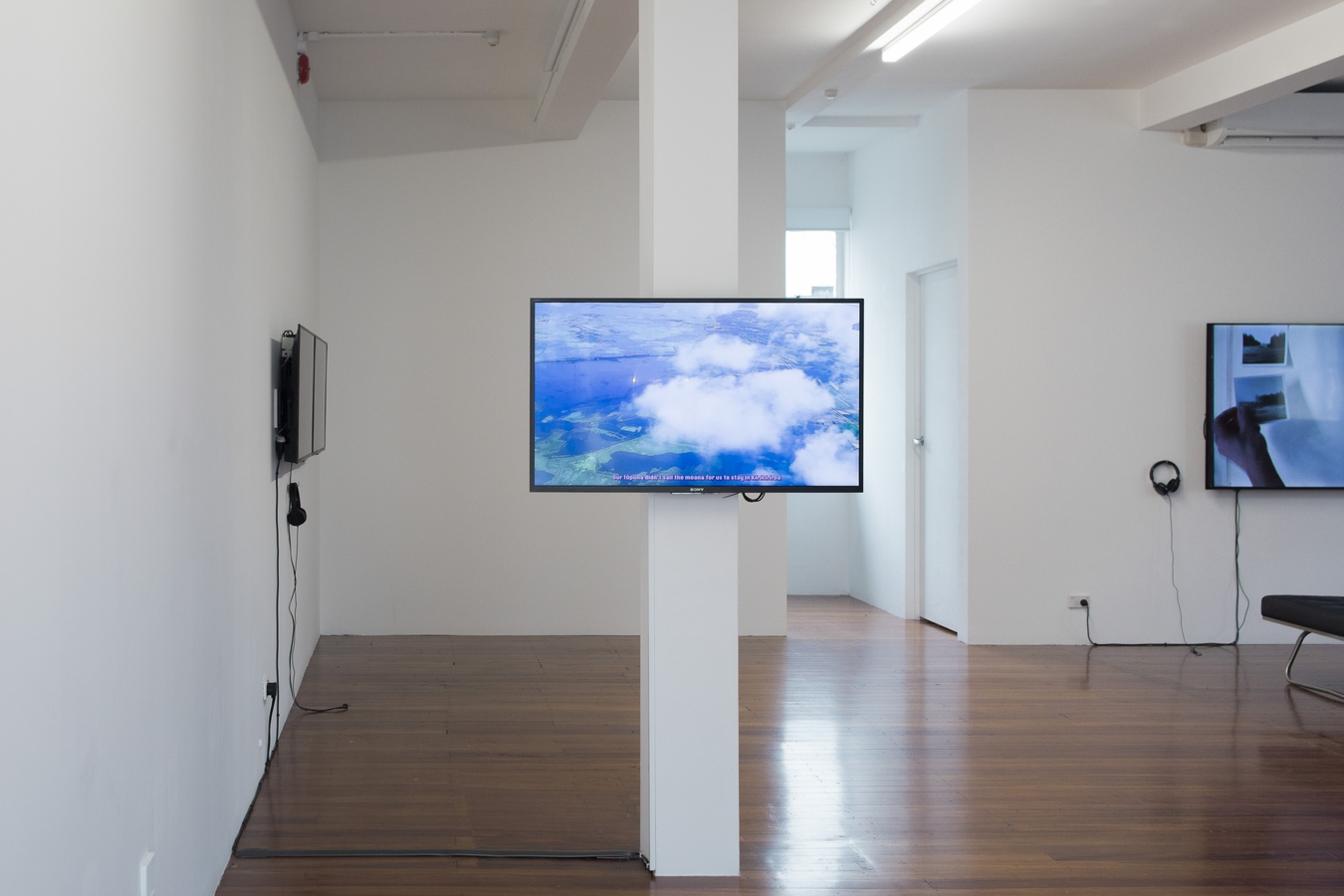 Homing Instinct (install view), 2024, with work by Kahurangiariki Smith with Buntheun Oung, Mā te Moana, 2024 (foreground) and Dieneke Jansen, This Housing Thing, 2021 (back). Image by Janneth Gil.