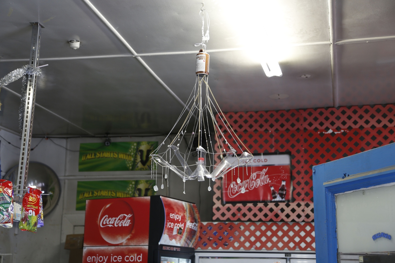 Signe Rose, Lion Brown chandelier  2014light fitting, beer can, coke bottle, chains, rhinestones, jewellery findings