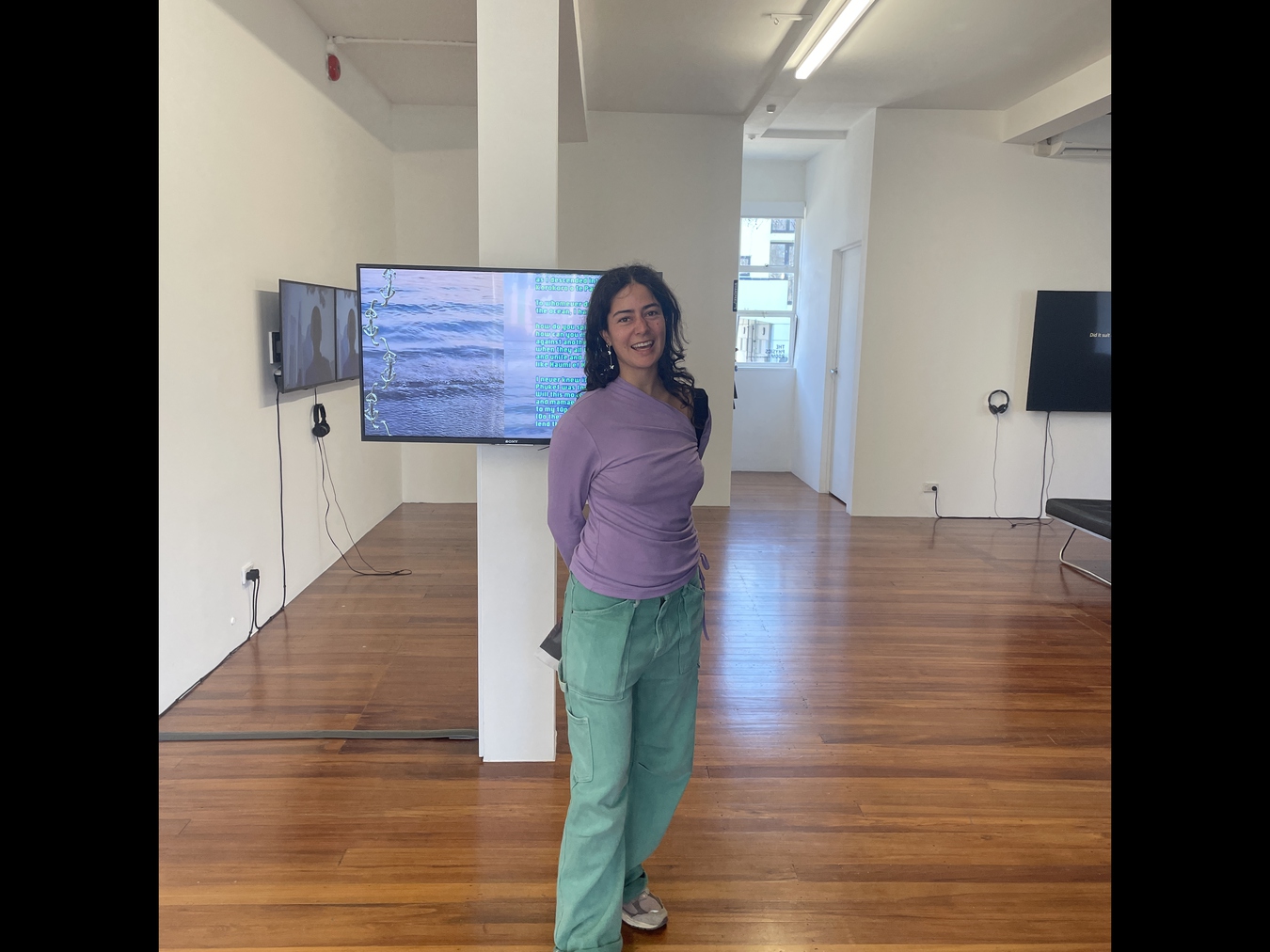 Kahurangiariki Smith in front of her work Mā te Moana (2024), included in Homing Instinct