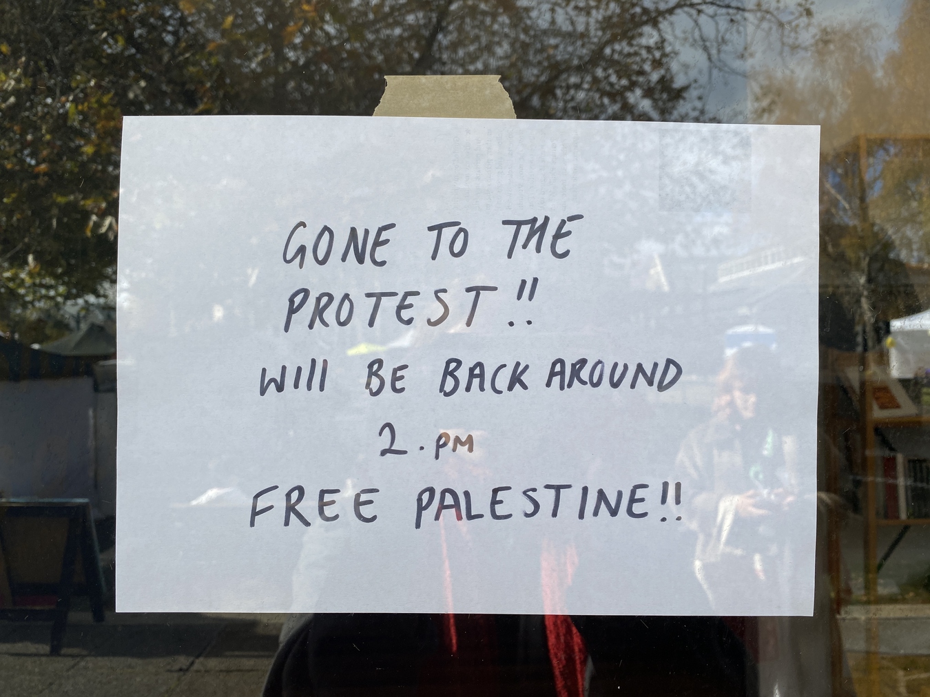 Sign on the door to The Physics Room reads "Gone to the protest!! Will be back around 2pm. Free Palestine!"